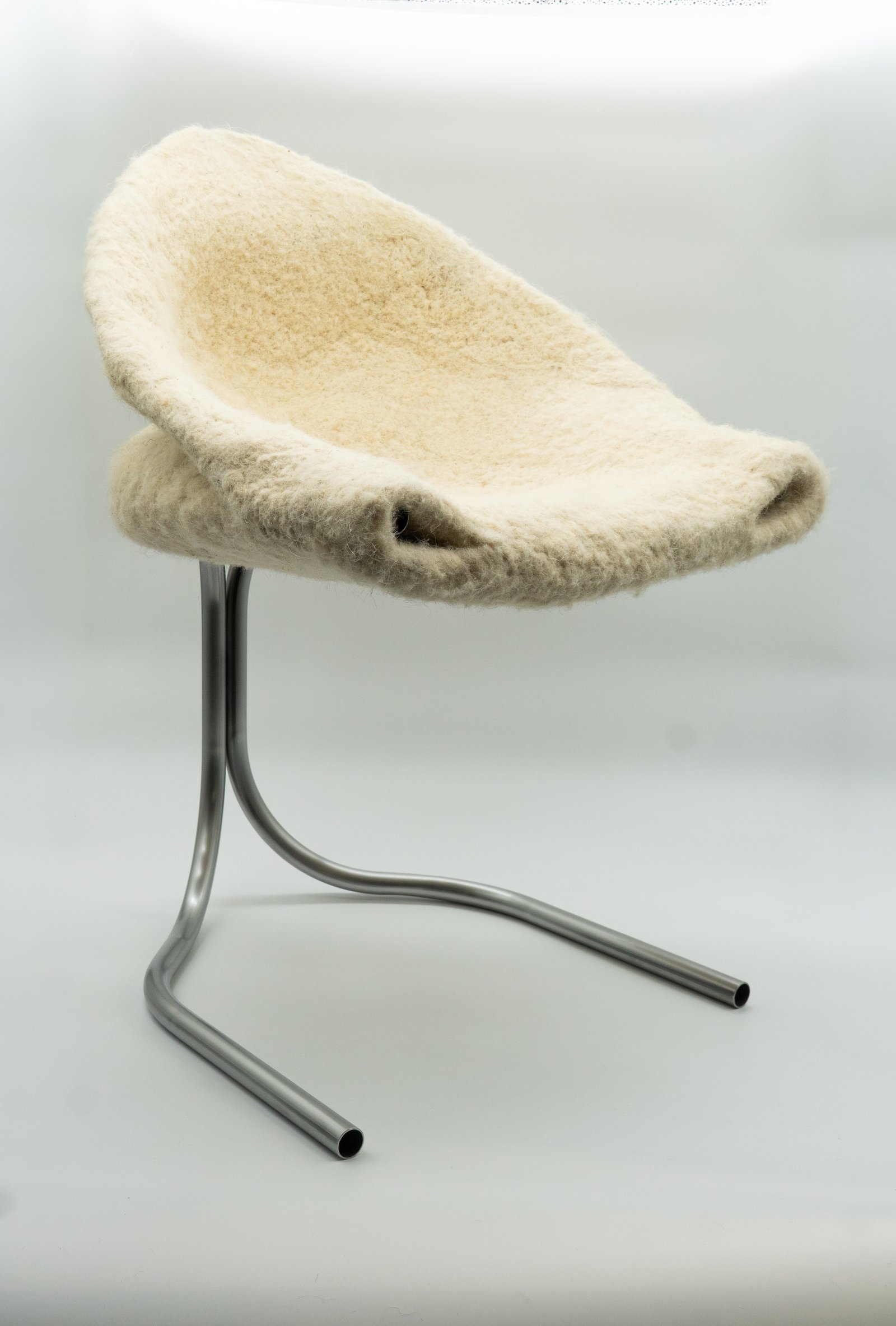 Unkempt — structural needle-felted chair in kempy British wool